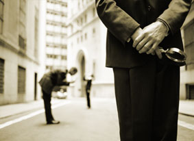 Image of men with magnifying glasses